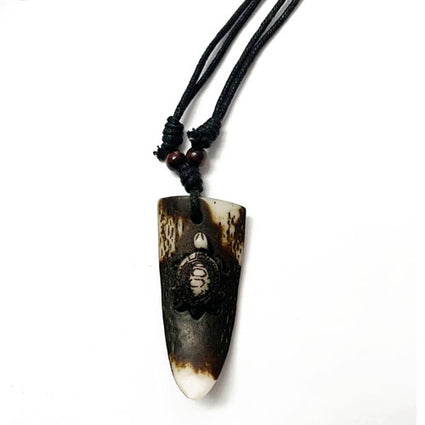 Resin eagle on tusk pendant NK